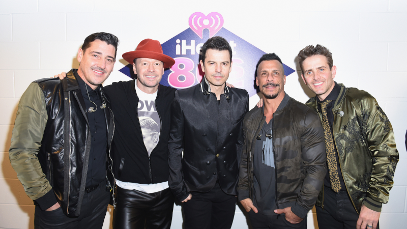 Image via Getty: Jonathan Knight, Donnie Wahlberg, Jordan Knight, Danny Wood and Joey McIntyre